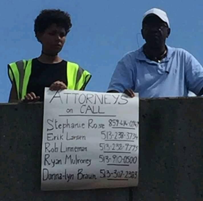 Erik's name on a poster at a protest. He is always available.